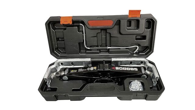 Cric Knott pentru rulotă 1.250 kg – 9949131 – Fotografie de la producător cu valiză și scule; nu confirmă includerea sculelor. Pachetul descris se limitează la conținutul documentat.